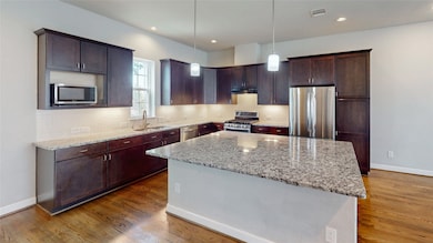 Located on the 2nd floor, this Modern kitchen feat