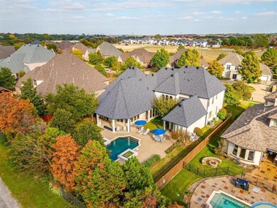 Mature trees along fence line creating a private oasis and outdoor living.