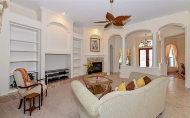 Large great room with gas fireplace and high volume ceilings