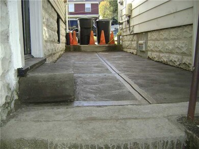 Exterior Front. Newly poured concrete sidewalk bet