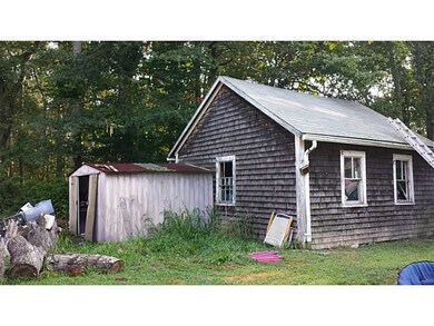 Exterior Back. Garage and Shed