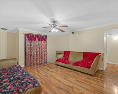 Living room featuring wood finished floors, ceilin