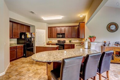 View of kitchen from built in breakfast counter.  Plenty of seating.  Great for entertaining