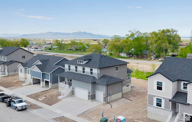 Aerial perspective of suburban area featuring a mountainous background