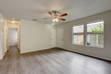 Empty room featuring ceiling fan, wood finished f