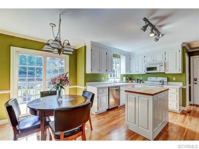 The Kitchen is Light and Bright with White Cabinet