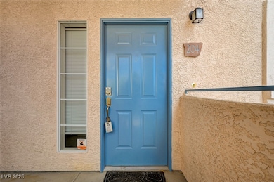 View of exterior entry with stucco siding
