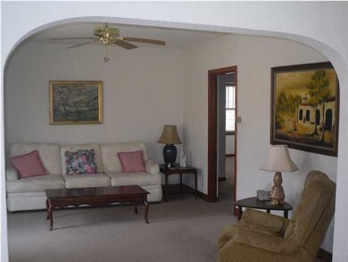 Arched Doorway to Large Living Room