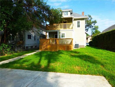 Exterior Back. Upper Balcony from backyard.