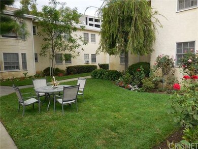 Front of unit is the court yard beautifully landsc