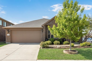 Front of the house featuring landscaped front yard