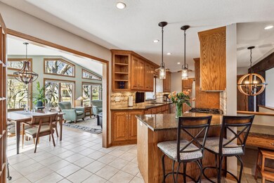 Kitchen leads right into the light filled sunroom