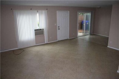 Family room with tile flooring. Dining room has sl