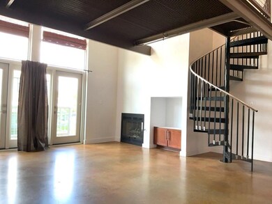 Unfurnished living room with concrete floors, a t