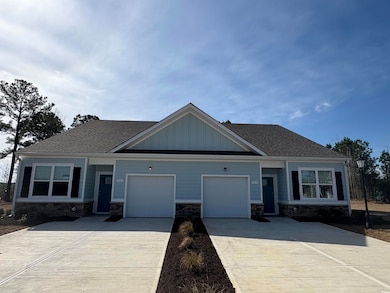 Craftsman house with board and batten siding, ston