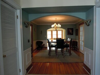 Dining Room. Arched doorways connect the dining ro