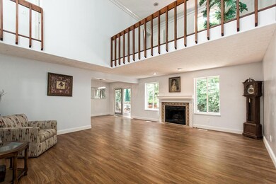 Spacious living room with loft/den view