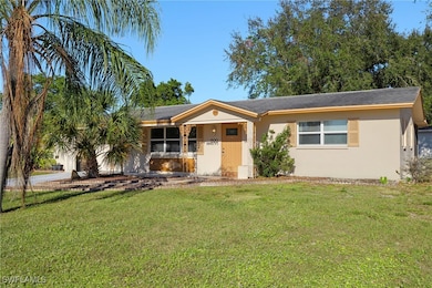 Ranch-style home featuring a front yard