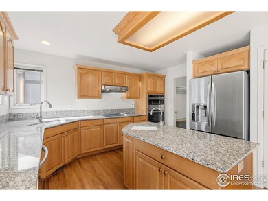 Kitchen with wood cabinets, stainless steel appliances and granite counter tops