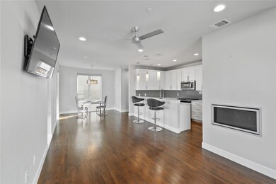 Kitchen with dark hardwood / wood-style flooring, 
