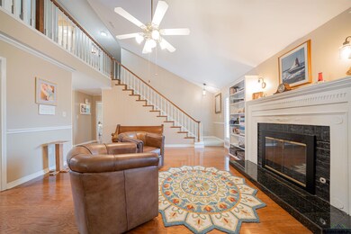 Living room with high vaulted ceiling, ceiling fan
