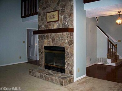 Entry. Home was custom built -- rock fireplace is 2 stories tall.  Vaulted ceiling in GR.