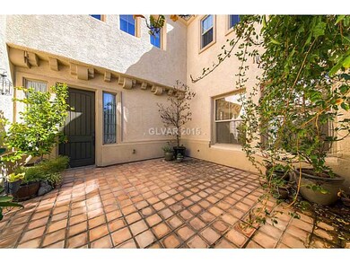 Facade/Exterior Front. Entry courtyard
