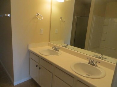 Full bath featuring tile patterned flooring, a sin
