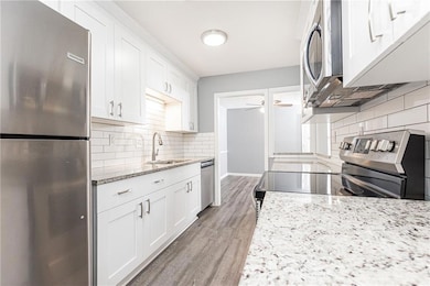 Stainless steel appliances, granite counter tops a