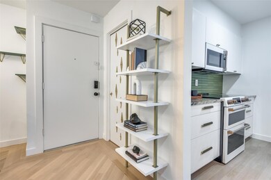 Entryway featuring light parquet floors