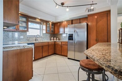 Kitchen is open to dining which is open to living