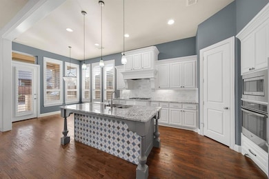 Abundance of cabinets and work area, with a walk i