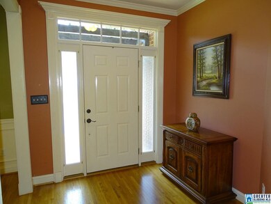 Welcoming foyer with hardwood flooring.