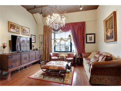 Living area has extra large window and gorgeous li