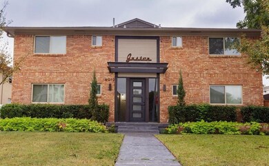 View of front of house with a front lawn and brick