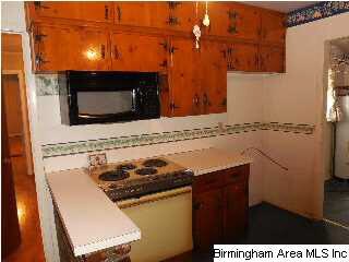 Breakfast bar opens into eat in kitchen area