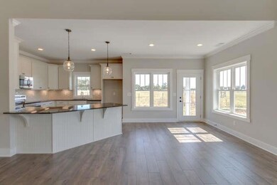 Laminate Hardwood floors in kitchen, eat in, living area, and foyer.  