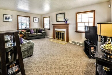 Spacious living room with berber carpeting, multip