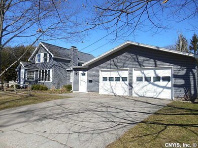 Exterior Front. 2-Car+ Garage Workshop w/Woodstove