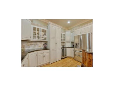 Open Kitchen has Hardwood Floors, Granite Counters