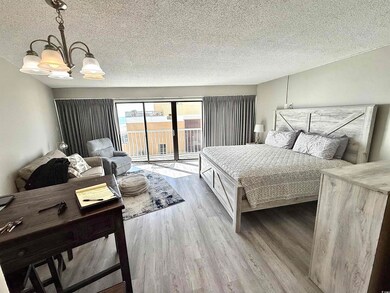 Bedroom featuring a textured ceiling, access to ou