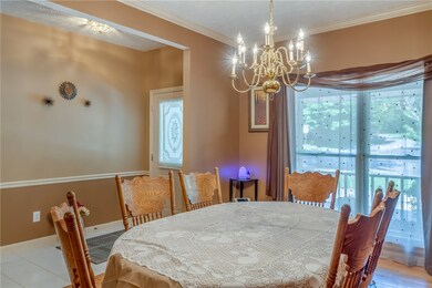 The tiled Foyer opens into the formal Dining Room