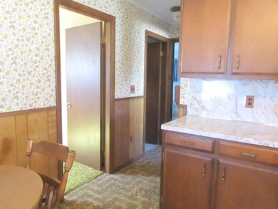 To hallway from kitchen
