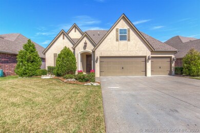 Stately stucco exterior with 3 car garage.