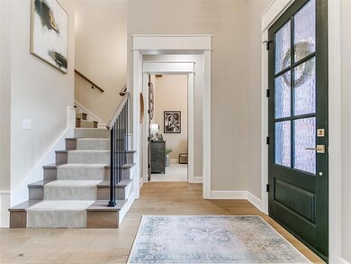 Foyer with plenty of natural light and light hardw