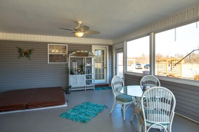 Relaxing Sunroom Over Looking Pool with Sunken Hot Tub.