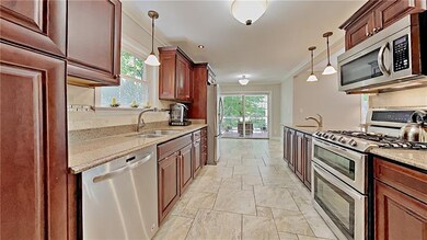 Renovated kitchen with granite counter tops and st