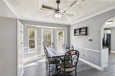 Another view of the dining area with a nice built-in and door to deck.