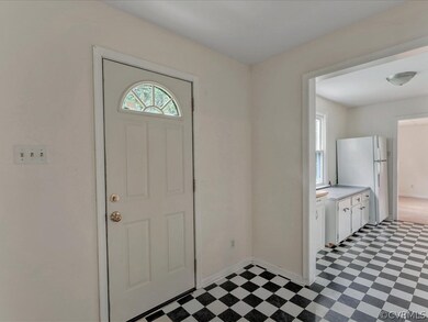Additional Room between Kitchen and Laundry room could be reconfigured for an UPDATED AND EXPANDED KITCHEN!