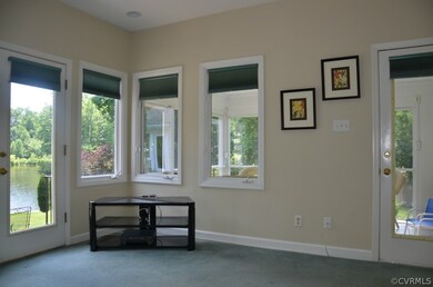 Sunroom/Den with pocket door to great room. Also f